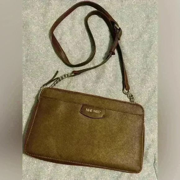 Nine West Crossbody brown with silver hardware. Snap closure and zipper pockets. - Picture 2 of 11
